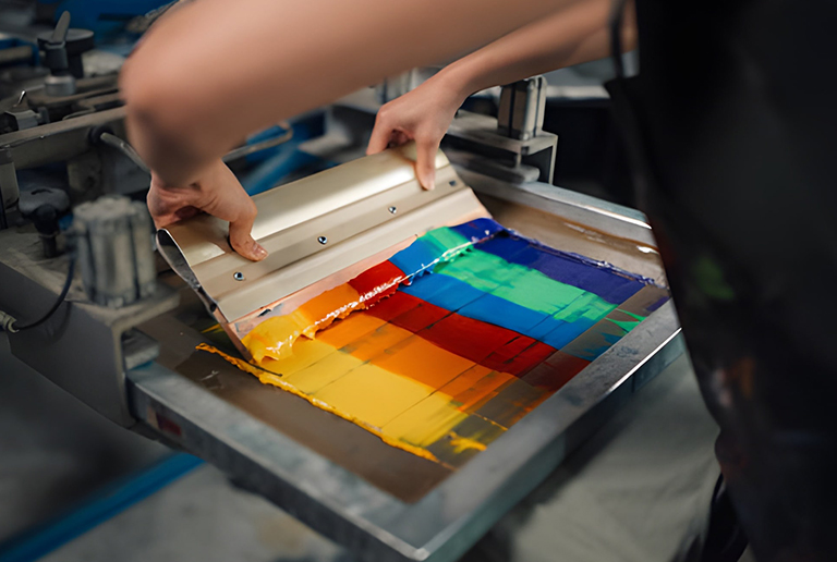 Bright rainbow screen print in Sahara Oasis workshop.