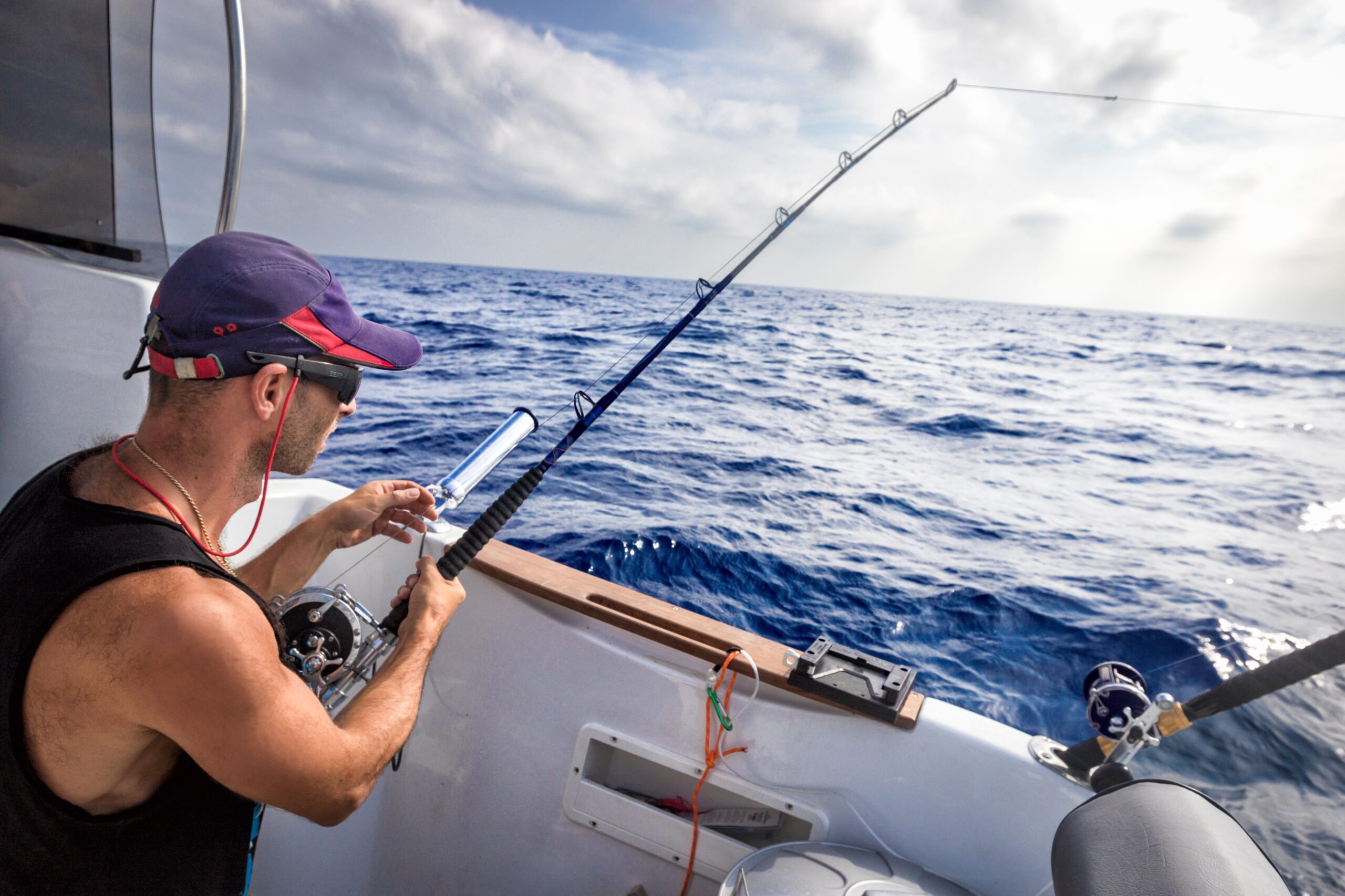 Participant fishing from a boat during a recreational outing
