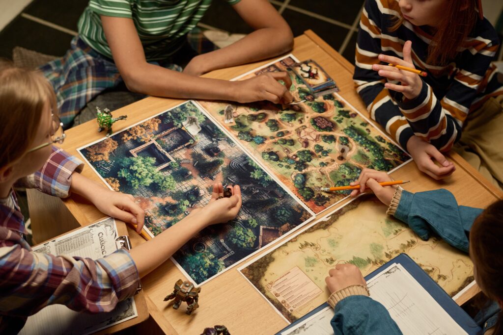 Group of people playing a strategy board game at a table.